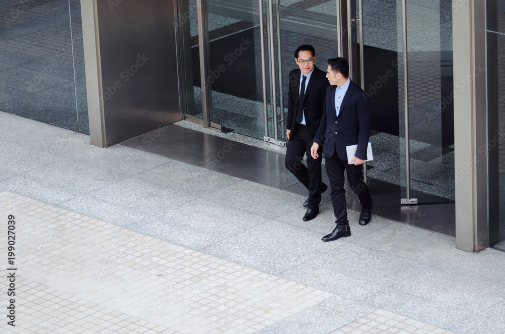 two business young asian smart man talking information about finance news together standing in front of Bank in city, congratulation, success, meeting, partner, teamwork, community, connection concept two business young asian smart man talking information about finance news together standing in front of Bank in city, congratulation, success, meeting, partner, teamwork, community, connection concept