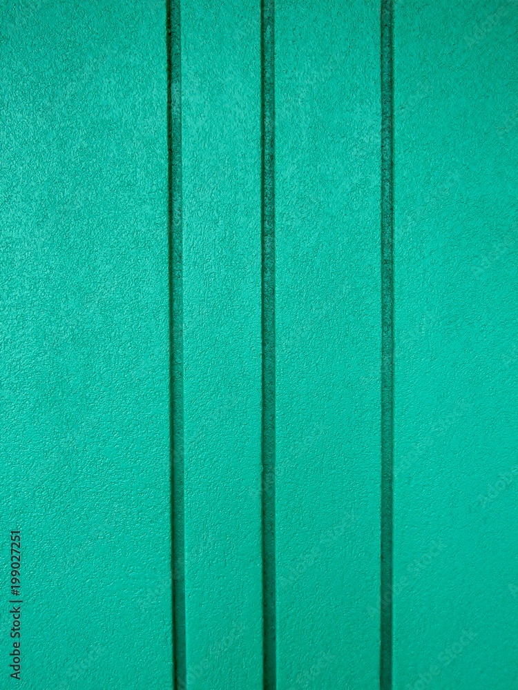 Fototapeta premium Turquoise blue grooved concrete wall background texture