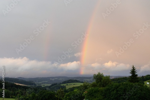 Two rainbows in the sky in landscape