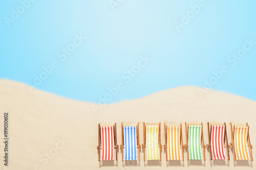 Aerial view of the beach resort with copy space. The concept of summer vacation. Multicolored sun loungers in a row on the sand photo