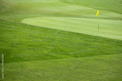 Golf flag on the green grass