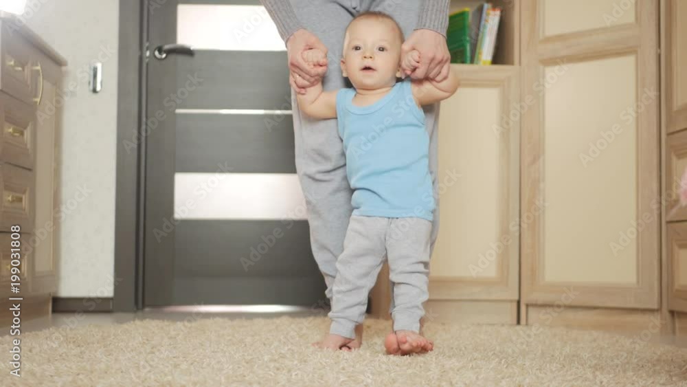 baby taking first steps with mother help baby taking first steps with mother help