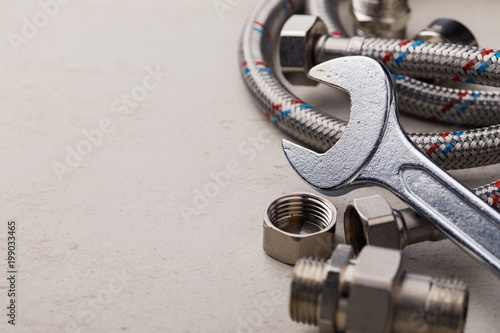 Plumbing tools for connecting water taps with space for text, closeup photo