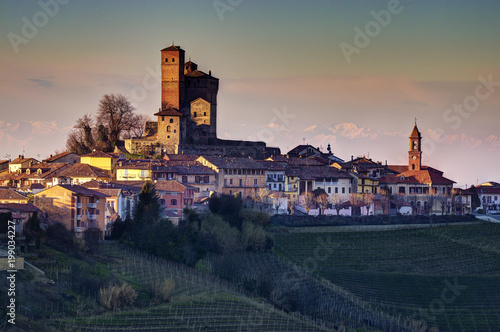 The scenic castle of Serralunga d'Alba stands out on the village, surrounded by vineyards. UNESCO World Heritage Site.