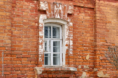 White window and Detail of house exterior on red wall. © ryabis