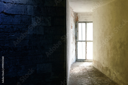 Bright window in the dungeon or in the bunker. Image divided into two halves