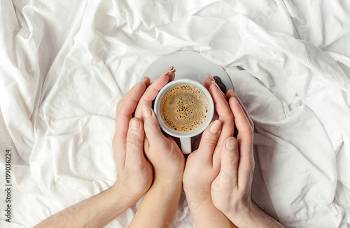 Coffee in bed. Selective focus.  photo