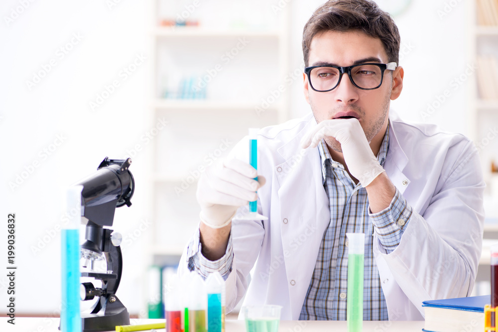 Chemistry student doing chemical experiments at classroom activi Chemistry student doing chemical experiments at classroom activi