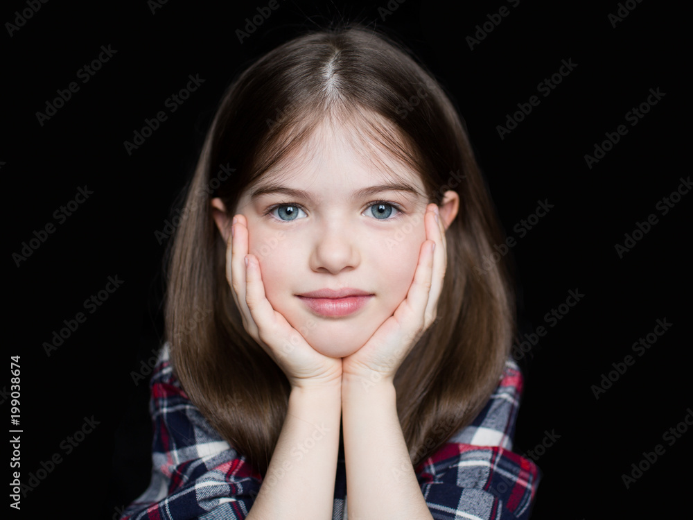 portrait of a cute beautiful girl in a plaid shirt on a dark background portrait of a cute beautiful girl in a plaid shirt on a dark background