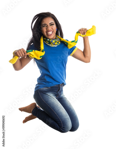 Brazilian woman fan celebrating on football match on white background. Brazil colors.