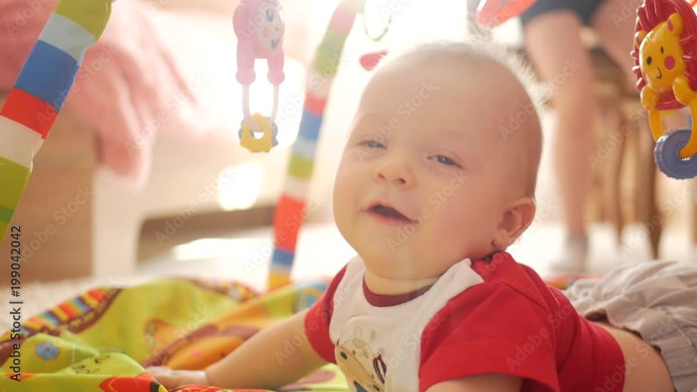 Adorable little boy playing in children room Adorable little boy playing in children room