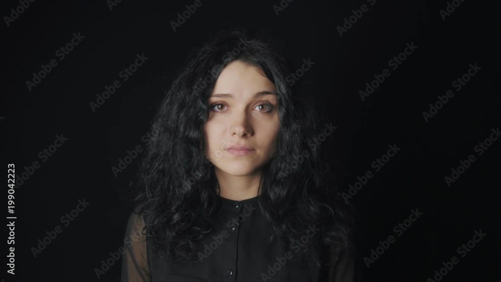portrait of woman with brown eyes at black background portrait of woman with brown eyes at black background