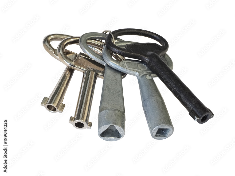 Close-up of special technical keys. Five iron and steel keys. Isolated on white background. High-quality macro photography. Close-up of special technical keys. Five iron and steel keys. Isolated on white background. High-quality macro photography.