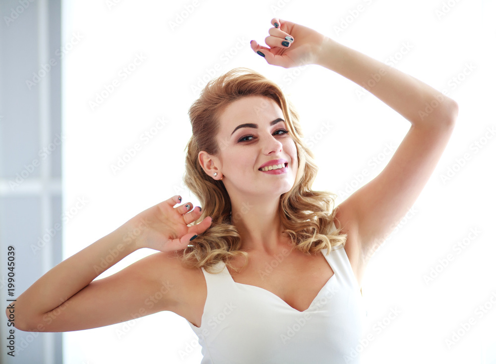 Happy woman relaxes at home freedom and ease enjoy life Happy woman relaxes at home freedom and ease enjoy life