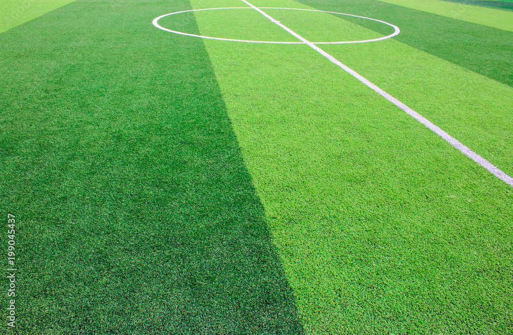 Obraz premium The white Line marking on the artificial green grass soccer field