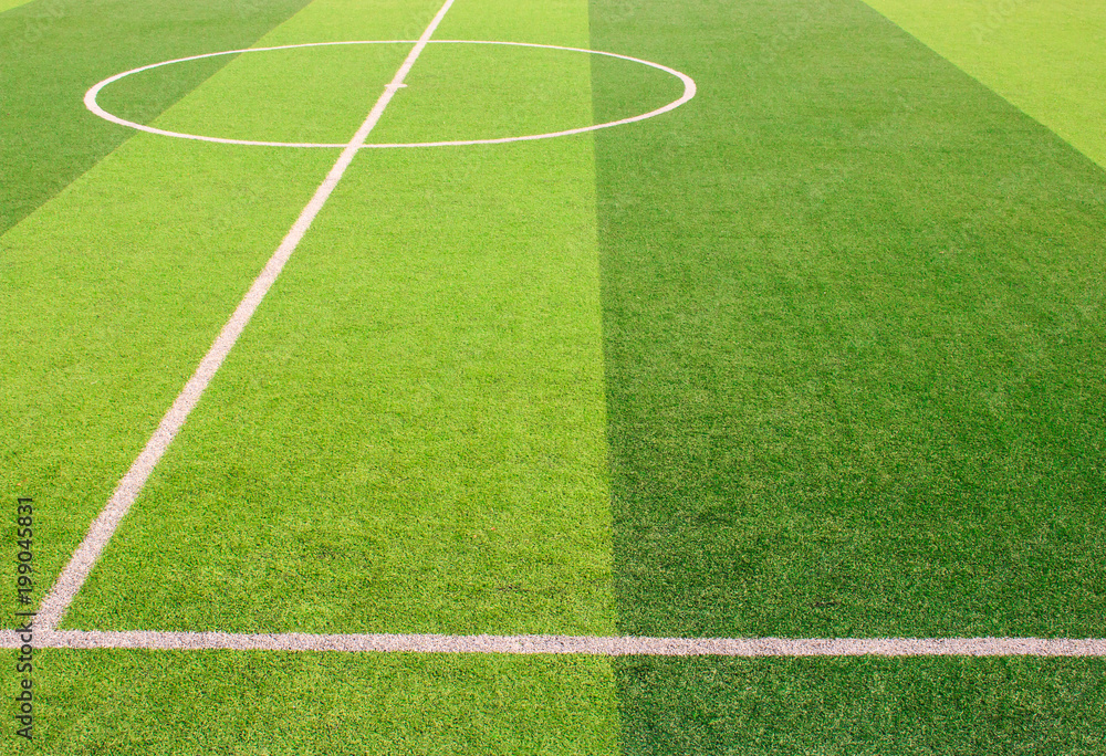 The white Line marking on the artificial green grass soccer field