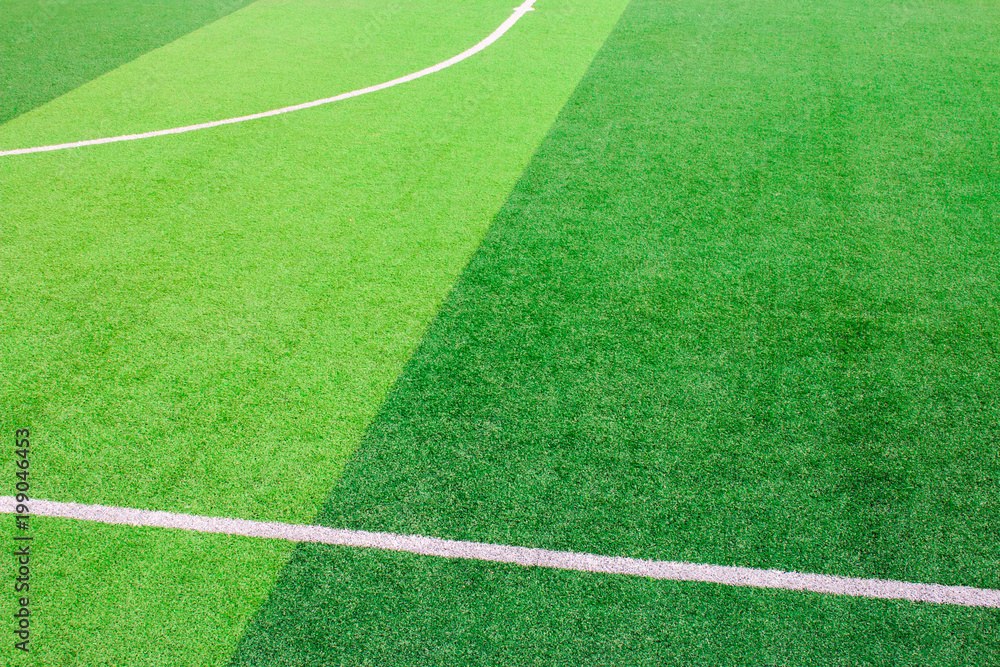 Obraz premium The white Line marking on the artificial green grass soccer field