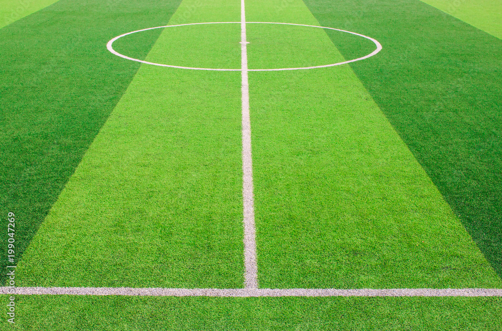 Obraz premium The white Line marking on the artificial green grass soccer field