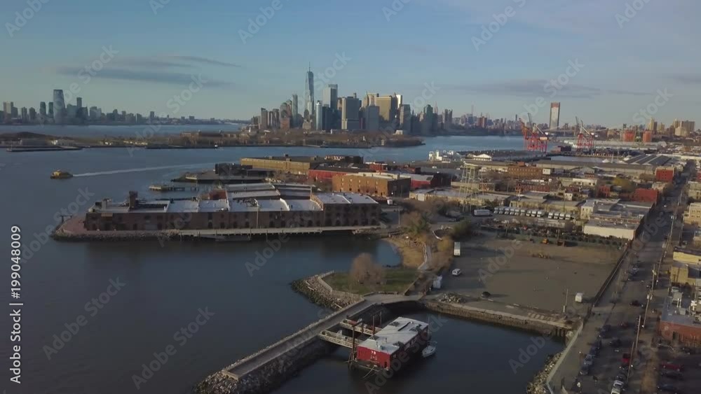 day flying backwards over Red Hook waterfront away from Manhattan skyline day flying backwards over Red Hook waterfront away from Manhattan skyline