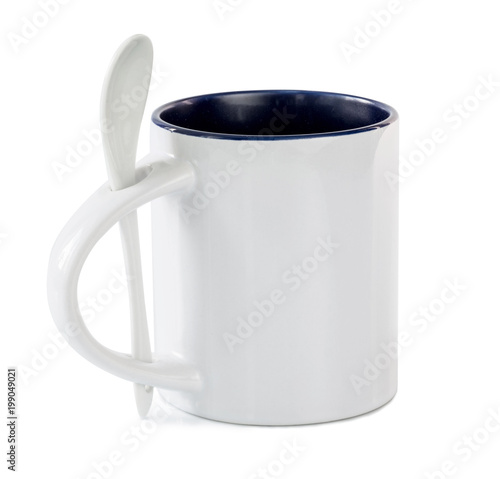 White cup with colored mid with white teaspoon isolated on a white background