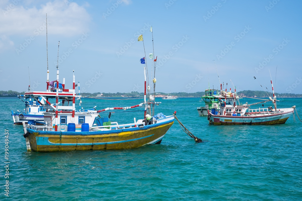 Several traditional local boats to catch fish in Weligama Bay. Fishing indusrty in Sri Lanka