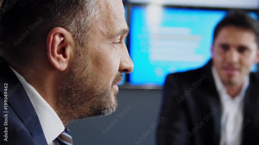 Two business man during meeting . Two business man during meeting .