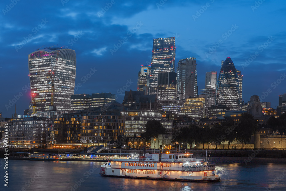 Fototapeta premium Thames embankment and london skyscrapers in City of London in the night