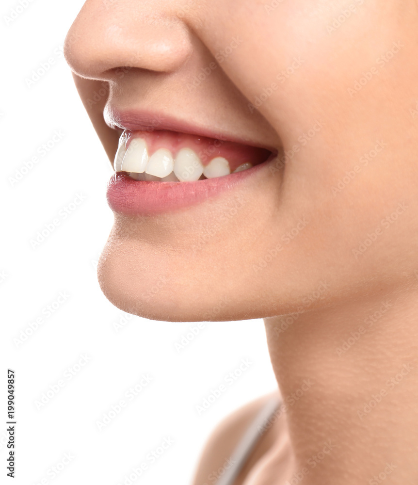 Obraz premium Young woman with beautiful smile on white background, closeup. Teeth whitening