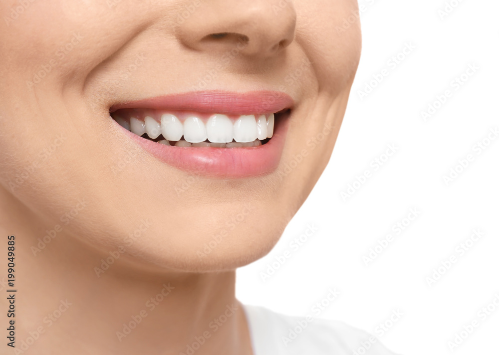 Young woman with beautiful smile on white background, closeup. Teeth whitening Young woman with beautiful smile on white background, closeup. Teeth whitening