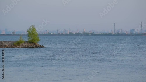 Scenic waterscape with Kyiv hydroelectric power station on background of Kiev city, capital of Ukraine photo