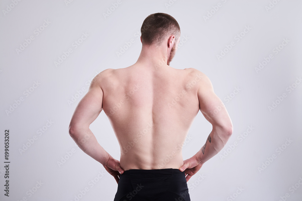 strong man showing his muscular back