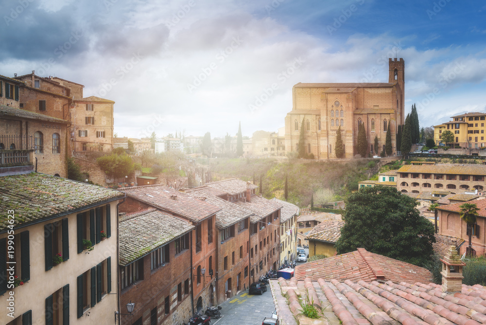 The pictorial urban landscape in the romantic atmosphere of a medieval city, Siena.