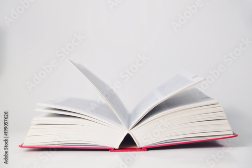 Open thick book on a table