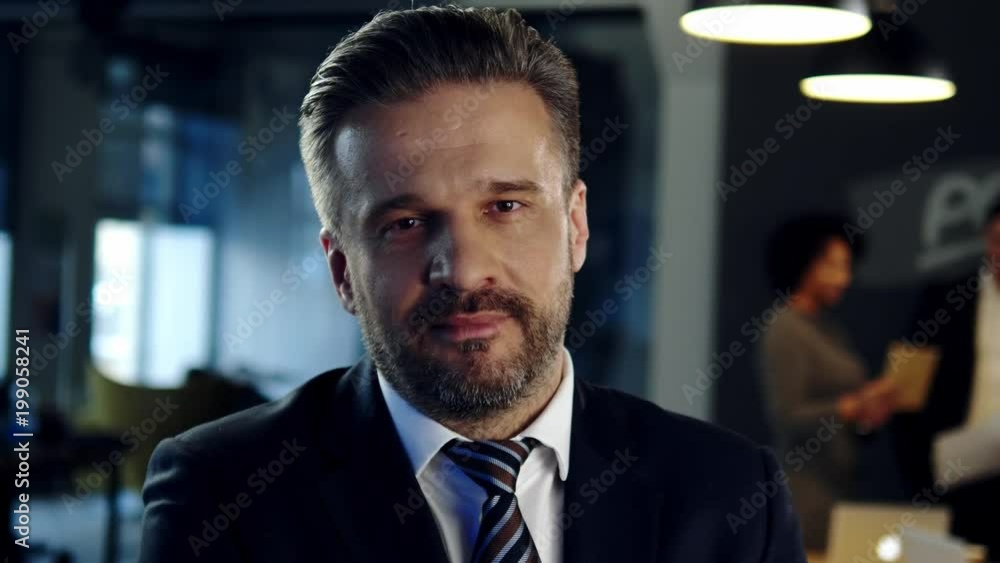 Middle-aged businessman in an office. Middle-aged businessman in an office.