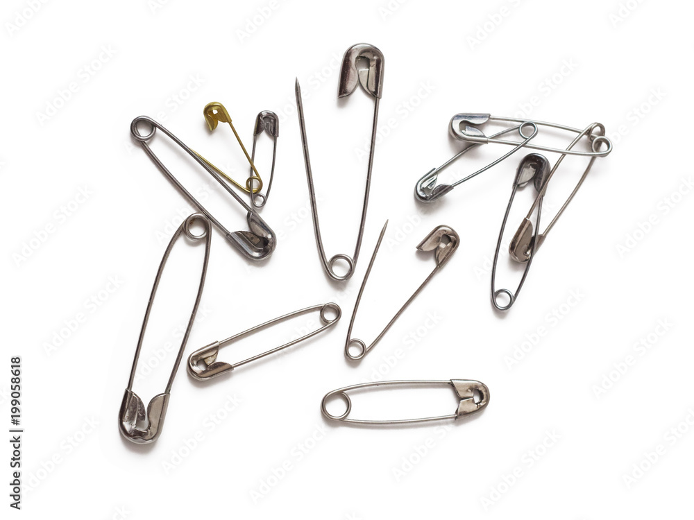 safety pins on white background safety pins on white background