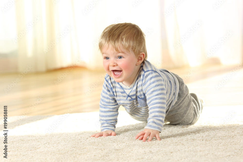 Cute baby crawling and laughing on the floor Cute baby crawling and laughing on the floor