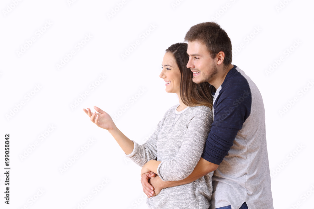 Couple presenting a blank space on white background Couple presenting a blank space on white background