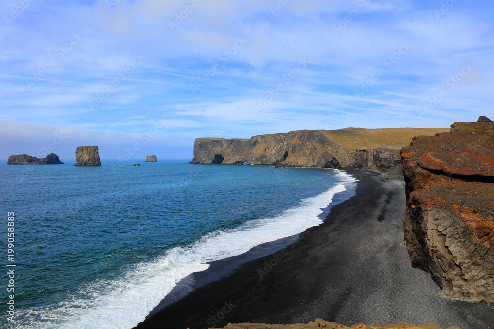 Beautiful black lava beach in Dyrholaey Iceland Beautiful black lava beach in Dyrholaey Iceland