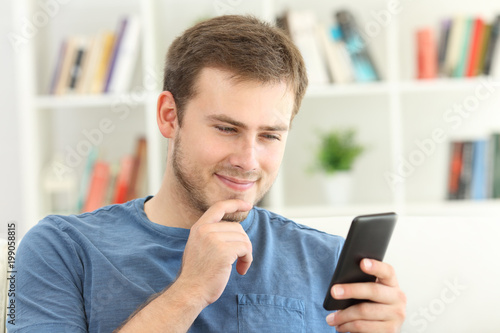 Interested man finding on line content on a smart phone