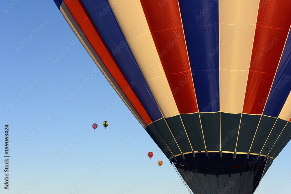 Obraz premium Close-up of Colorful Hot Air Balloons in Blue Sky