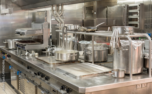 Modern stainless steel hobs in commercial kitchen