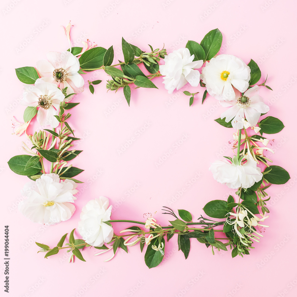 Floral round frame made of white flowers on pink background. Flat lay, top view. Pastel background. Floral round frame made of white flowers on pink background. Flat lay, top view. Pastel background.
