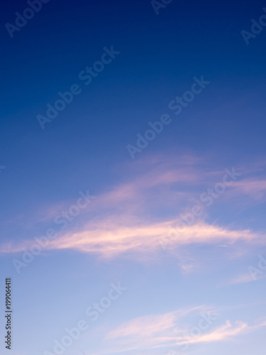 Fluffy clouds in the blue sky with morning light from the sunrise