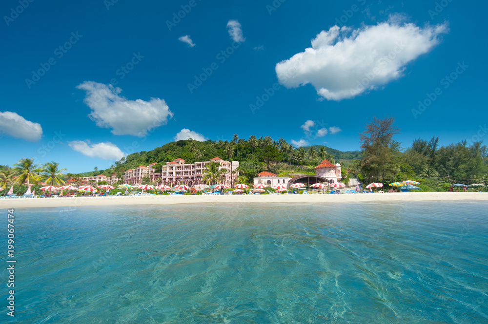 Beach in Thailand. The island of Phuket. Sand beach. A sunny day on the island of Phuket. Holiday for tourists in Thailand.
