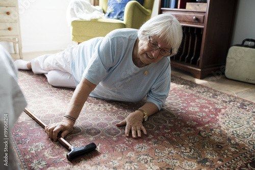 Slika na platnu Elderly woman fell on the floor