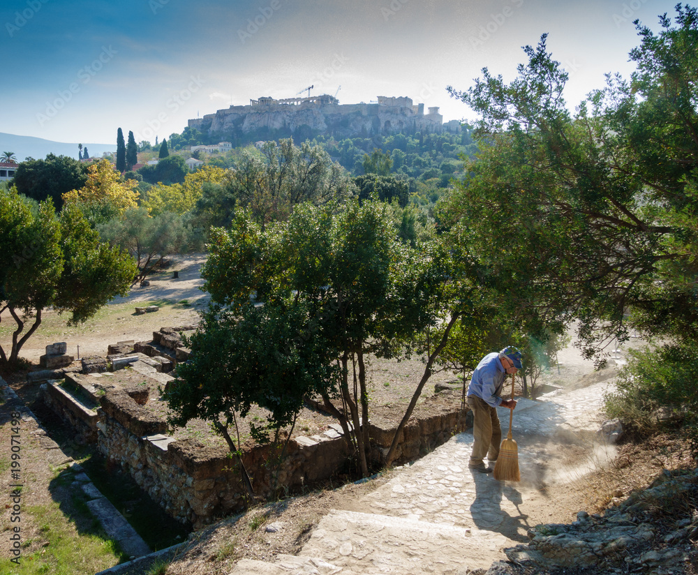 Man sweeping with broom at garden Man sweeping with broom at garden