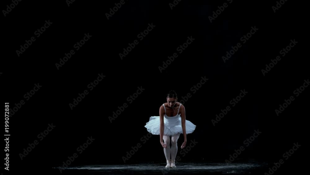 Ballerina performing on black background spinning slow motion Ballerina performing on black background spinning slow motion