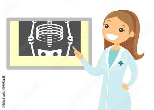 Caucasian white radiologist doctor in a medical gown examining a skeleton radiograph