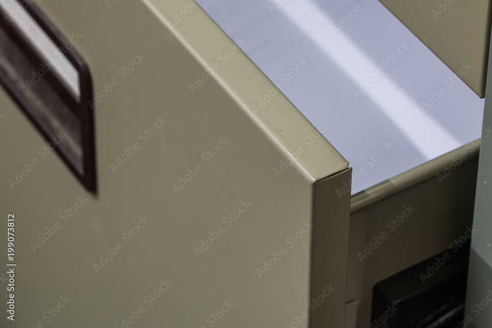 Close-up open a drawer in the table, background with copy space Close-up open a drawer in the table, background with copy space