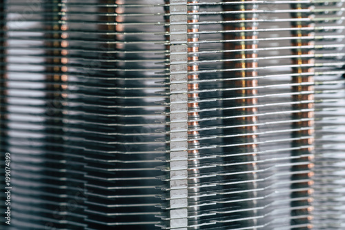 Aluminum radiator with copper heat pipe close-up with beautiful bokeh photo